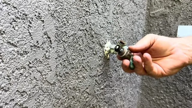 Tightening washer screw on valve stem at a Tempe residence
