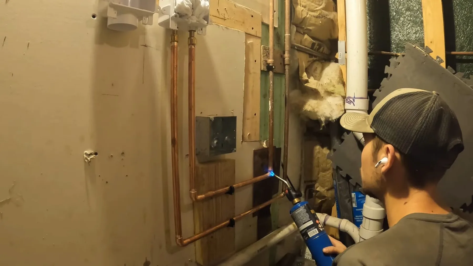 Washer dryer plumbing in open basement wall on a plumbing job in Tempe